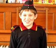 Student in old Aramoho mouth organ band uniform. 