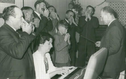 Mouth organ players and keyboard. 