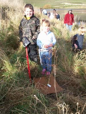 Here is Connor planting
his tree. 