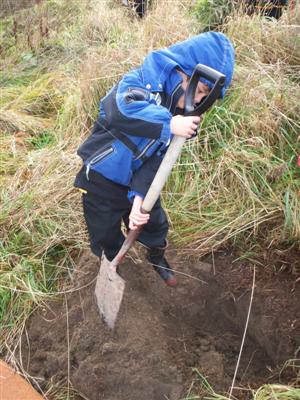 Here is Tarras planting his tree. 