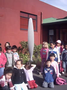 Children next to a Propeller. 