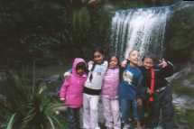 Kids by waterfall.