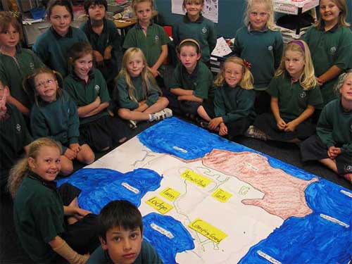 Year 3 learners with their map of Shakespear Regional Park.