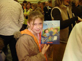 Student holding book. 