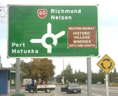 Photo of road sign post to the town of Motueka. 