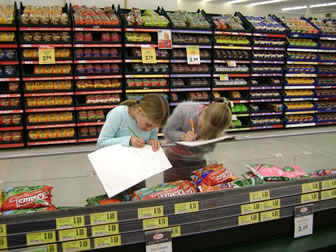 Image of students researching at New World Supermarket