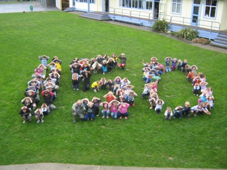 We all formed the number 150 for the cover page of our School Cookbook comemorating the years of teaching and learning.
